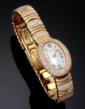 Cartier Lady's Mini Baignoire quartz in 18KYG with bracelet and Diamonds. B&P