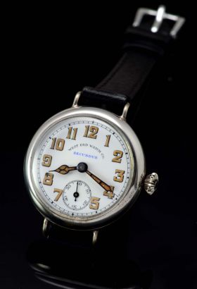 West End Watch Co C.1920s 32mm "Secundus" Trench Watch style manual winding with white enamel dial in alloy/steel