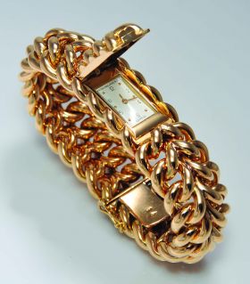 Patek Philippe C.1945 lady's hunter case chained bracelet watch in 18KYG