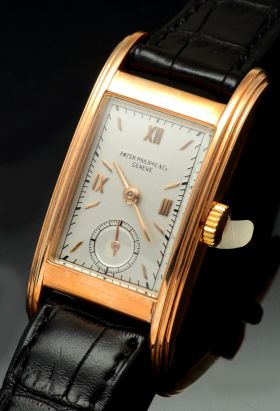 Patek Philippe & Co., Genève C.1941 Ref.514 Long rectangular & curved case with stepped sides in 18KPG