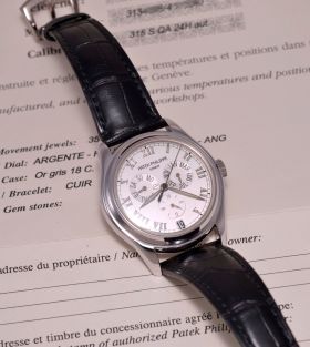 2002 Patek Philippe, 37mm "Annual Calendar" automatic Ref.5035G glass back in 18KWG with Cert and Patek warranty