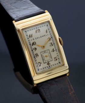 Vintage Movado Circa 1930s Jumbo Art Deco style Rectangular Tank for retailer "JE Caldwell" manual winding in 14KYG