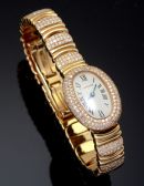 Cartier Lady's Mini Baignoire quartz in 18KYG with bracelet and Diamonds. B&P