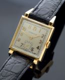 C.1946 Tiffany & Co by CH Meylan top grade manual winding in 18KYG rectangular case & faceted lugs