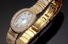 Cartier Lady's Mini Baignoire quartz in 18KYG with bracelet and Diamonds. B&P