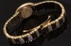 Cartier Lady's Mini Baignoire quartz in 18KYG with bracelet and Diamonds. B&P