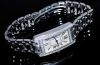 Cartier, lady's "Tank Américaine" quartz Ref.WB710009 in 18KWG with Diamonds